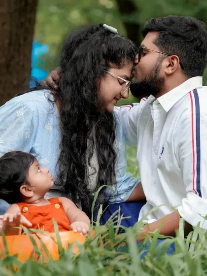 Our hearts are full with this little one. A tender moment between parents and their baby, surrounded by nature.