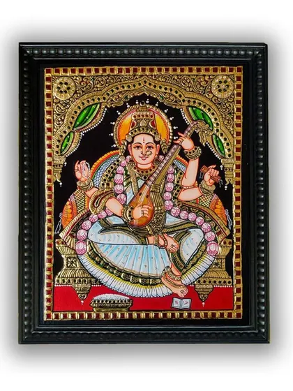 The framed Saraswati Tanjore painting, ready to be a centerpiece of devotion and inspiration. Its timeless beauty is suitable for any home or office environment.