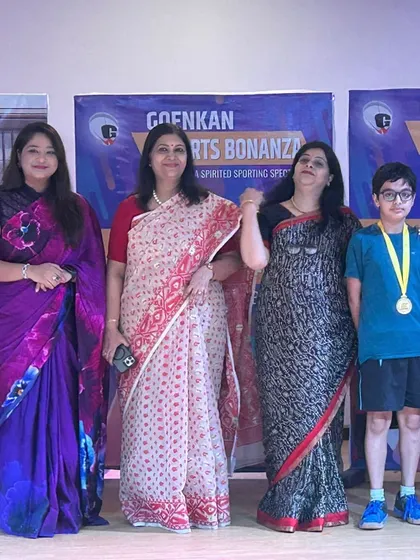 One of our young players, Laksh Malik, stands proudly with his medal after securing 1st position in the Under-14 Boys category at an Inter-School Tournament.
