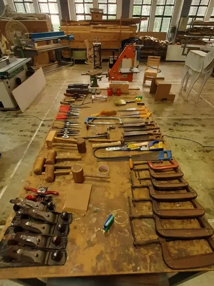 This is the arsenal of a craftsman. Our workshop is fully stocked with a wide variety of hand tools, from planes and chisels to clamps and mallets, ready for any project.
