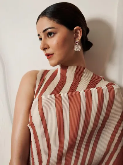 A closer look at Ananya Panday wearing the Cherry Blossom earrings. The vibrant Mozambique rubies from Gemfields add a pop of color, making them a standout piece.