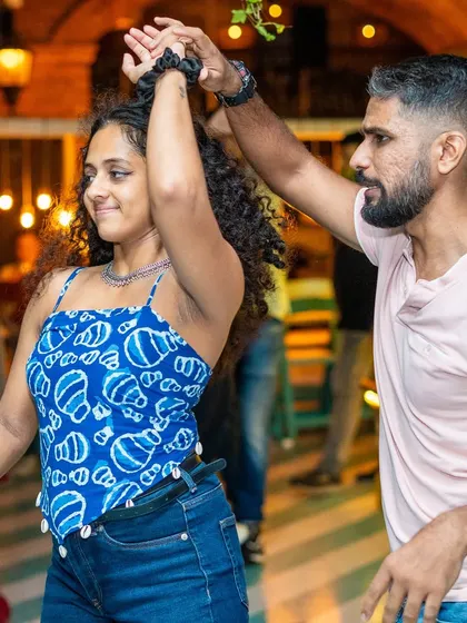 A beautiful turn during a lively Salsa dance. I love seeing our dancers connect with the music and each other with such style.