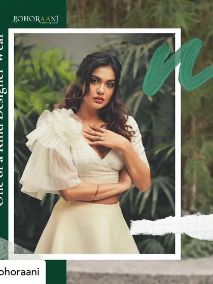 We believe in creating one-of-a-kind designer wear that you can live in. This image features our custom-styled ruffled blouse, a testament to our commitment to unique designs.