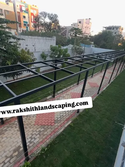 An elevated view of the completed walkway and lawn at the Kodigehalli apartment building.