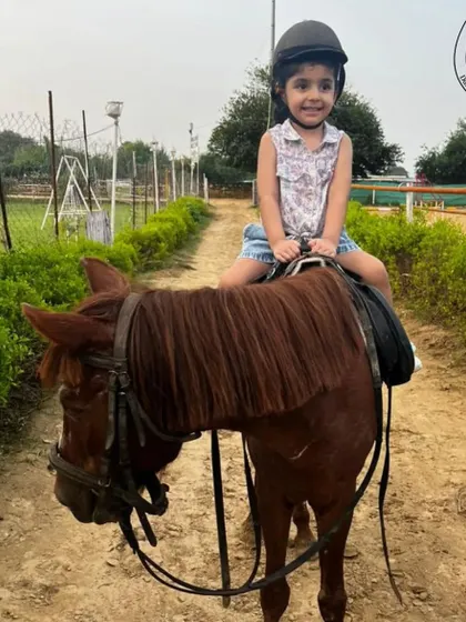 Another happy rider on her first equestrian adventure. We ensure every child's experience is positive and memorable.
