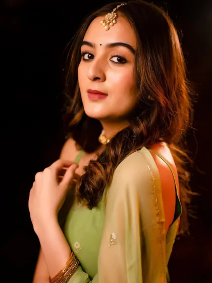 A classic portrait pose, looking over the shoulder. It's an elegant and timeless shot.