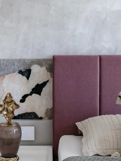 A close-up of the backlit marble wall, showing the rare, partially transparent quality of the stone that allows light to filter through, creating a unique and captivating feature.