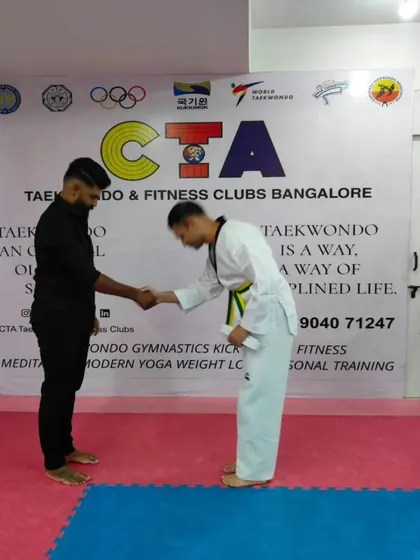 A handshake and bow of respect.