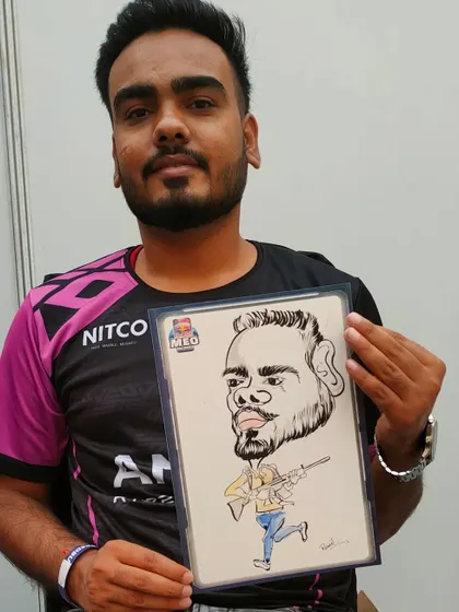 This gamer's caricature features him with a rifle, a nod to the BGMI esports event we were at.