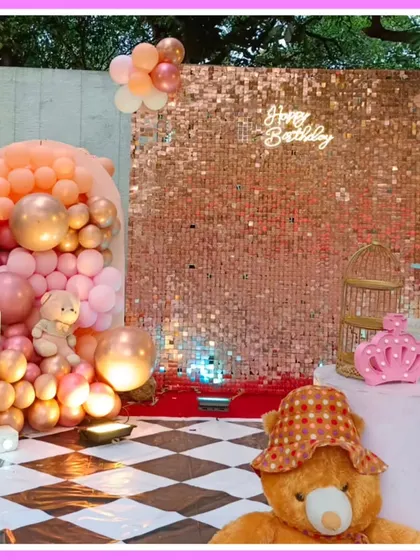 A teddy bear-themed first birthday with a rose gold sequin wall and a checkered floor.