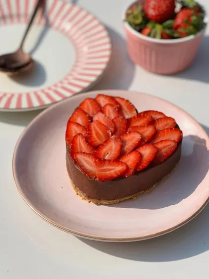 For Valentine's Day, we created this heart-shaped mini Belgian chocolate mousse cake. Topped with freshly sliced strawberries, it’s a rich and romantic dessert for two.