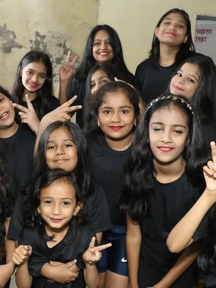 A happy group of our young dancers backstage, ready to go on stage and shine.