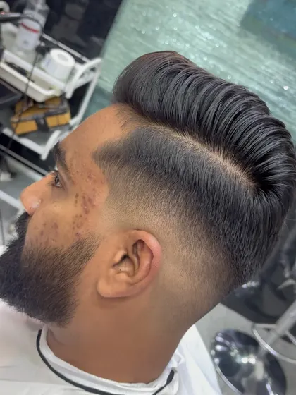 A close-up of the pompadour's volume and the fade's sharpness.