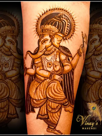 This depiction of Lord Ganesha holding an axe symbolizes the power to remove obstacles. We study the meaning behind different postures and symbols to create more meaningful art.