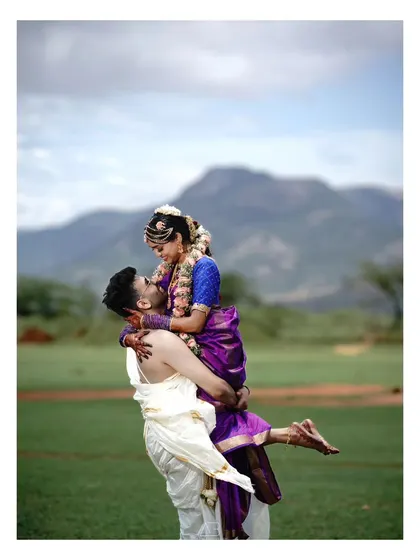 A sweeping, romantic gesture against a stunning natural backdrop. This kind of shot is perfect for a pre-wedding album, capturing the grand scale of your love.
