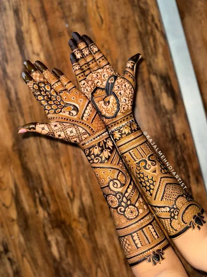 A special bridal design where two peacocks come together to form a heart shape when the hands are joined.