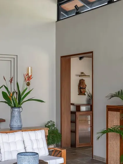 A glimpse from the living room into a bedroom at Grove House, showing the continuity of the high ceilings and natural light.