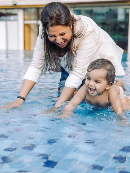 A first birthday splash. There's nothing like the delight on a child's face when they experience something new and fun, like playing in the water for the first time.