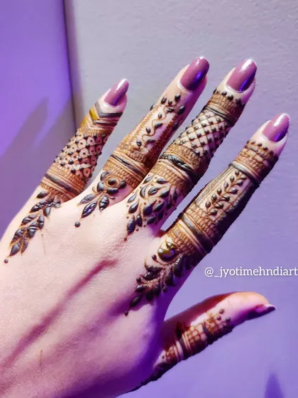 Another angle of the detailed finger designs, highlighting the clean lines and intricate work.