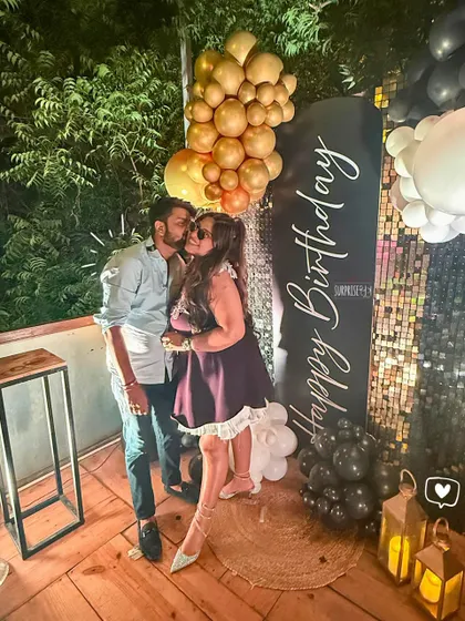 A sweet moment captured during the birthday celebration. Our glamorous outdoor setup provided the perfect backdrop for the couple's photos.