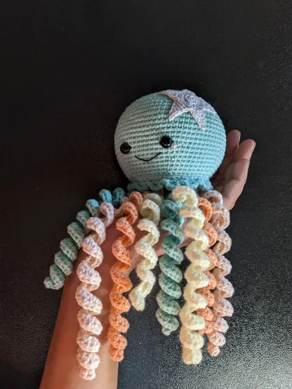Showing the long, curly tentacles of the jellyfish toy.