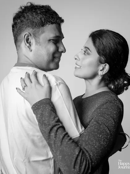 A timeless black and white portrait of a couple looking at each other with love. The simplicity of the shot emphasizes their deep connection.