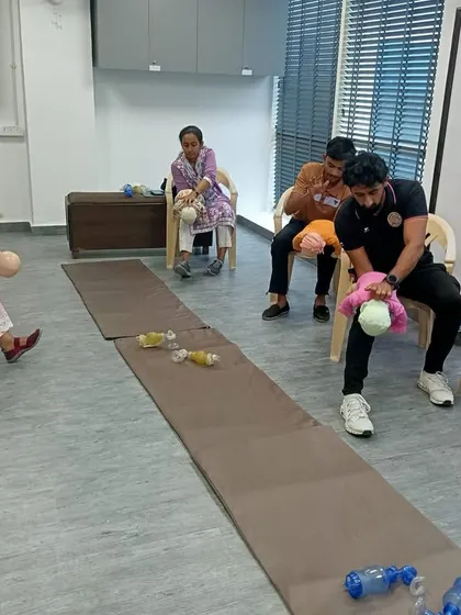 Our CPR training also covered techniques for infants. This image shows us practicing the correct procedure for infant rescue, an essential skill for any first responder.