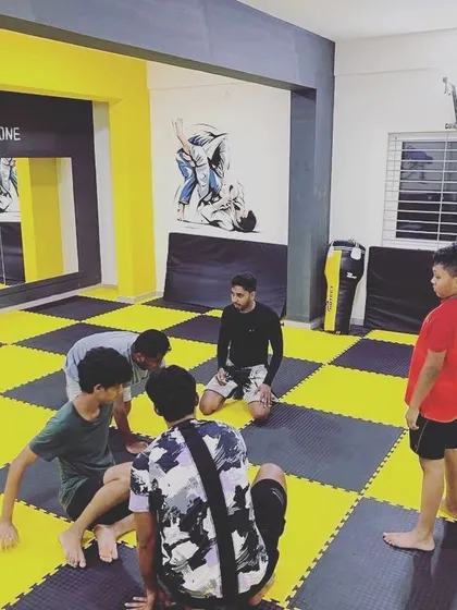 A moment from our youth jiu-jitsu class. I'm explaining a position to the kids. It’s amazing to see them focused and learning the art.