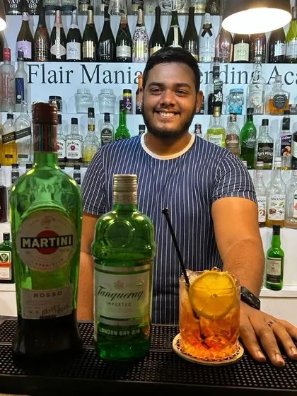 A student from our Goa branch with a gin and martini cocktail, learning the classics.