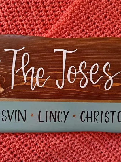 The rich brown stain on this pine wood plaque for "The Joses" allows the natural grain to shine through, complemented by the elegant white lettering and teal accent.