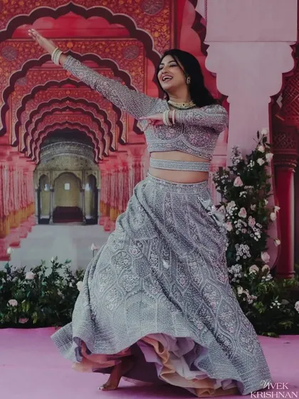 Amidst the grandeur of the Rajput palace-themed stage, the couple shares a playful dance. These are the candid, joyful moments that make a wedding celebration truly special.