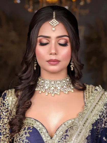 A close-up of the eye makeup, showing a beautifully blended smokey eye that adds depth and drama without being overpowering.