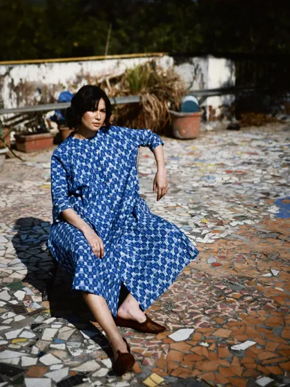 An outdoor shot for House of Wandering Silk on a mosaic rooftop. The natural light and interesting location add character to the fashion story.