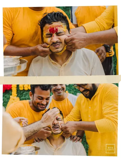 The groom's friends playfully smear turmeric paste on his face, a classic candid moment of fun and laughter from the Haldi.