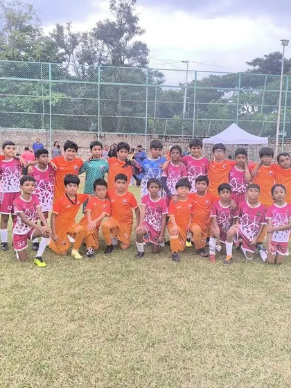 Our U11 Blues team with their opponents, Stallions FA, after a weekend match.
