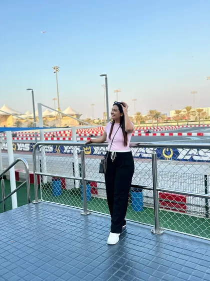 Overlooking the Yas Marina Circuit. A comfortable and casual outfit is perfect for exploring the island.