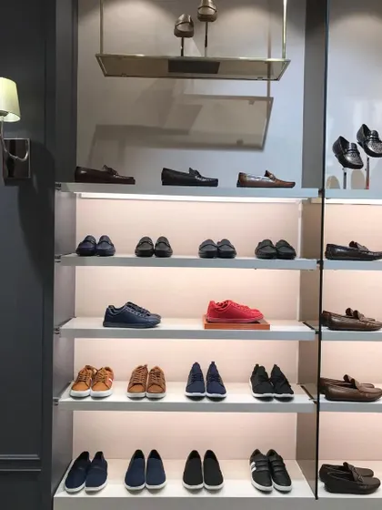 A well-lit display of men's formal and casual shoes.
