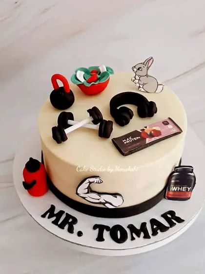 A gym themed cake for Mr. Tomar. I included all the essentials: dumbbells, a kettlebell, headphones, a protein shaker, and even a healthy salad.