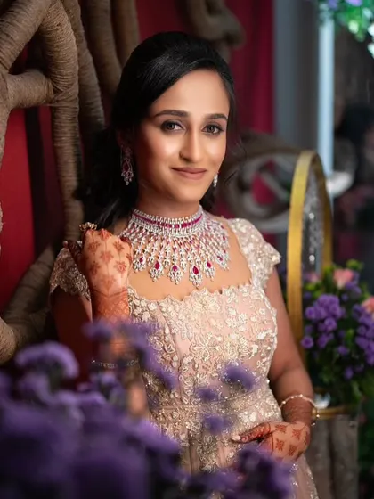 This bride is the picture of modern elegance. The training will cover how to create these polished looks, complete with soft waves and makeup that enhances the sparkle of her diamond and ruby jewelry.