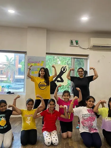 Our strong little dancers showing off their muscles after a strength and flexibility class!