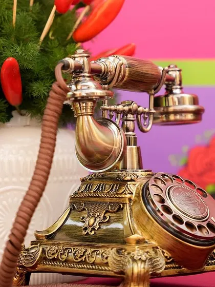 A close-up of a vintage-style telephone, used as a decorative prop to add a touch of nostalgia and whimsy.