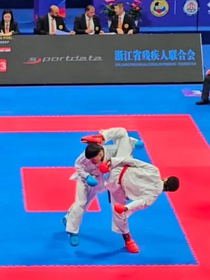 Executing a takedown during the Asian Championship. Grappling and sweeping techniques are crucial for a well-rounded Kumite fighter, and we incorporate these drills into our training.