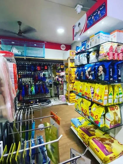 Another angle of our store layout, showing the aisles dedicated to cat food and pet accessories. We ensure products are clearly organized by type and brand.