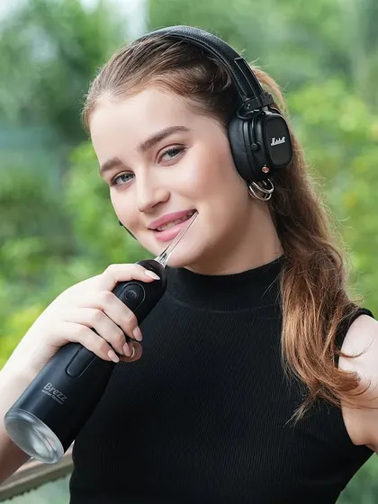 Another lifestyle shot with headphones, reinforcing the product's place in a contemporary, tech-savvy lifestyle.