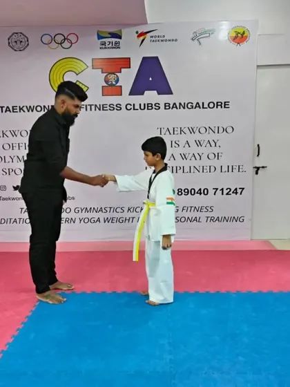 A handshake for a new yellow belt.