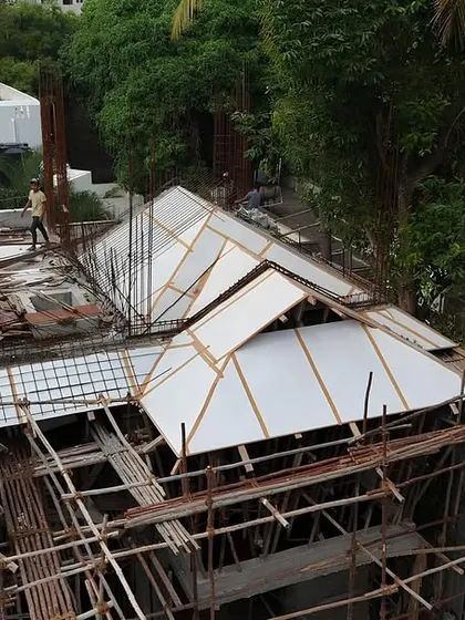 Workers on-site, constructing the intricate formwork for the roof. Our turnkey service means we are there every step of the way, managing the skilled labor that brings our complex designs to life.