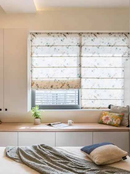 Maximizing a bay window with a cozy seating design. This setup includes a long bench with storage underneath, perfect for enjoying the view.