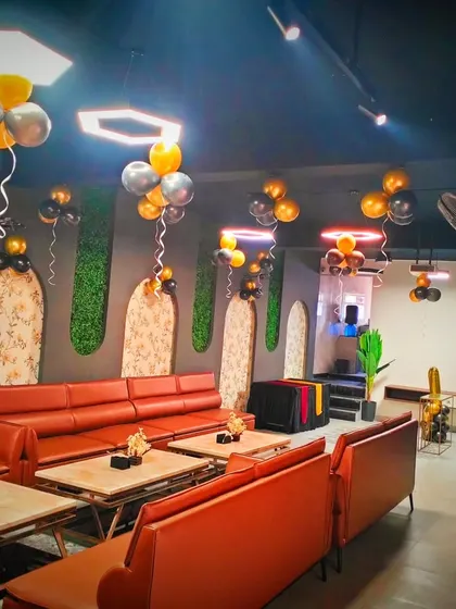 Another view of the private room party, showing how the balloon clusters are placed to decorate the entire length of the room.