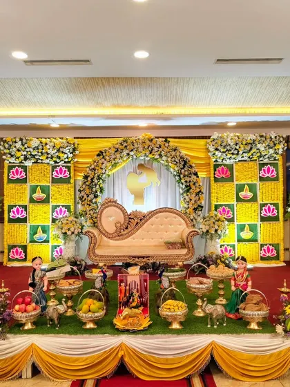 The full view of the yellow-themed baby shower stage.