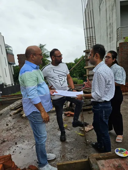 A group discussion on-site with the client and their architect. Teamwork is essential to translate a Vastu plan into a physical reality.